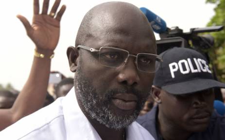 Former footballer George Weah speaks to journalists after casting his ballot for the second round of presidential elections on December 26, 2017 at a polling station in Monrovia. Picture: AFP