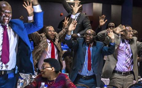 Zimbabwe’s Members of Parliament celebrate after Robert Mugabe’s resignation on 21 November 2017 in Harare. Picture: AFP.
