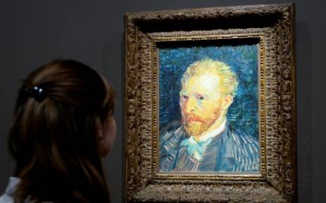 FILE: A visitor looks at a self-portrait by late Dutch painter Vincent Van Gogh displayed at the Orsay Museum in Paris. Picture:AFP."