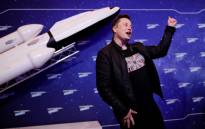 SpaceX owner and Tesla CEO Elon Musk gestures as he arrives on the red carpet for the Axel Springer Awards ceremony, in Berlin, on 1 December 2020. Picture: HANNIBAL HANSCHKE/POOL/AFP
