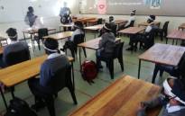 FILE: Grade 7 pupils at a Western Cape primary school on 1 June 2020 sit in class after schools reopened following a national coronavirus lockdown, which started on 27 March 2020. Picture: @WCEDnews/Twitter. 