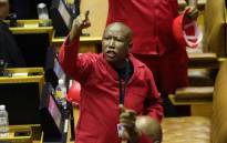 FILE: Economic Freedom Fighters (EFF) leader Julius Malema objects as South African President Cyril Ramaphosa attempts to deliver his State of the Nation Address at Parliament in Cape Town on 13 February 2020. Picture: AFP