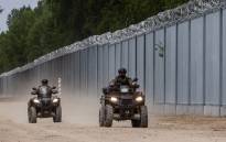Border guards patrol on quads along the border wall at the Polish-Belarusian border near Tolcze village, in Sokolka County, Podlaskie Voivodeship, in north-eastern Poland on June 8, 2022.
Wojtek. Picture: RADWANSKI / AFP