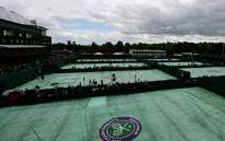 A photograph taken on June 27, 2022 shows covered courts as the rain started to fall on the first day of the 2022 Wimbledon Championships at The All England Tennis Club in Wimbledon, southwest London. Picture: SEBASTIEN BOZON / AFP