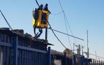 FILE: City Power workers fix overhead power cables at a sub-station in Alexandra on 3 July 2019. Picture: @CityPowerJhb/Twitter