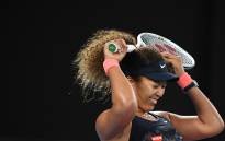FILE: Japan's Naomi Osaka celebrates winning against Jennifer Brady of the US during their women's singles final match on day thirteen of the Australian Open tennis tournament in Melbourne on 20 February 2021. Picture: AFP
