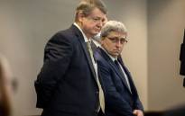 William 'Roddie' Bryan stands next to his attorney Kevin Gough after the jury handed down their verdict in the trial of Greg McMichel and his son, Travis McMichael, and a neighbor, William 'Roddie' Bryan in the Glynn County Courthouse on 24 November 2021 in Brunswick, Georgia. Picture: Stephen B. Morton-Pool/Getty Images via AFP