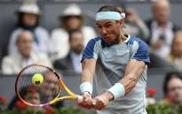 Spain's Rafael Nadal returns the ball to Serbia's Miomir Kecmanovic during their 2022 ATP Tour Madrid Open tennis tournament singles match at the Caja Magica in Madrid on 4 May 2022. Picture: OSCAR DEL POZO/AFP
