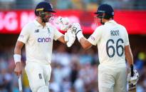 England's Dawid Malan (L) and Joe Root react at the end of play during day three of the first Ashes cricket Test match between England and Australia at the Gabba in Brisbane on 10 December 2021. Picture: Patrick Hamilton/AFP