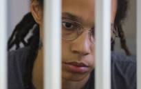 US' Women's National Basketball Association (WNBA) basketball player Brittney Griner, who was detained at Moscow's Sheremetyevo airport and later charged with illegal possession of cannabis, waits for the verdict inside a defendants' cage during a hearing in Khimki outside Moscow, on 4 August 2022. Picture: EVGENIA NOVOZHENINA / POOL / AFP