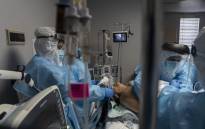 FILE: Medical staff members treat a patient suffering from the coronavirus disease in the COVID-19 intensive care unit at the United Memorial Medical Centre on 31 October 2020 in Houston, Texas. Picture: AFP.