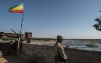 FILE: In this file photo, a member of the Amhara Special Forces watches on at the border crossing with Eritrea where an Imperial Ethiopian flag waves, in Humera, Ethiopia, on November 22, 2020.  Picture: AFP