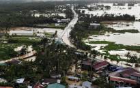 An aerial photo shows highway and houses submerged by flood waters in Abuyog town, Leyte province, southern Philippines, on April 11, 2022, following heavy rains brought about by Tropical storm Agaton. Picture: Bobbie ALOTA / AFP