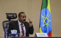 FILE: Ethiopian Prime Minister Abiy Ahmed gestures at the House of Peoples Representatives in Addis Ababa, Ethiopia, on 30 November 2020 to respond to the Parliament on the current conflict between Ethiopian National Defence Forces and the leaders of the TPLF. Picture: AFP. 