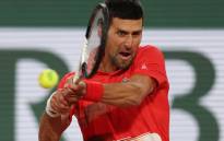 Serbia's Novak Djokovic returns the ball to Japan's Yoshihito Nishioka during their men's singles match on day two of the Roland-Garros Open tennis tournament at the Court Philippe-Chatrier in Paris on 23 May 2022. Picture: Thomas SAMSON/AFP