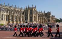 FILE: Members of the new guard of the 1st Battalion Grenadier Guards arrive before the Changing of the Guard at Windsor Castle in Berkshire, southeast England on 22 July 2021, which is taking place for the first time since the start of the COVID-19 pandemic. Picture: Andrew Matthews/POOL/AFP