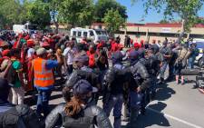 Public order police control EFF protesters who are on their way to demonstrate at the Brackenfell High School in Cape Town on 20 November 2020. Picture: @EFFWesternCape_/Twitter