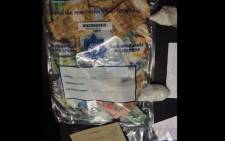 Officials confiscated cash and drugs during a home raid in Athlone, Cape Town. Picture: Supplied.