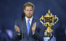 Honorary President of England Rugby 2015 Britain's Prince Harry applauds next to the Webb Ellis Cup during the opening ceremony of the 2015 Rugby World Cup at Twickenham stadium in south west London on September 18, 2015. Picture: AFP.