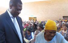 Maria Sibanda (87) pictured with Gauteng Human Settlements MEC Paul Mashatile after receiving the title deed to her home on 1 June 2017. Picture: Supplied