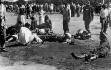 FILE: Wounded people lie in the street, 21 March 1960 in Sharpeville, near Vereeniging, where at least 180 black Africans, most of them women and children, were injured and 69 killed. Picture: AFP.