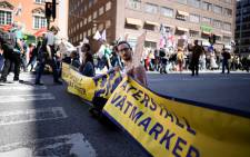 Activists of the Extincion Rebellion climate action movement block a street in central Stockholm on June 3, 2022, in connection with the Stockholm +50 UN meeting. Picture: 
Meli PETERSSON ELLAFI / TT News Agency / AFP