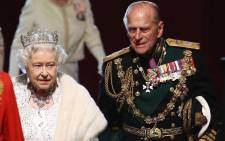 Queen Elizabeth II and Prince Philip at the Palace of Westminster after the state opening of Parliament on 8 May 2013 in London. Picture: AFP.