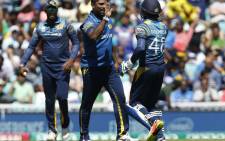 Sri Lanka players celebrate the fall of a wicket. Picture: AFP