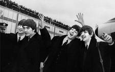 FILE: The Beatles with, from left to right, John Lennon, Ringo Starr, Paul McCartney and George Harrison, arrive at John F. Kennedy Airport in New York, on 7 February 1964. Picture: AFP