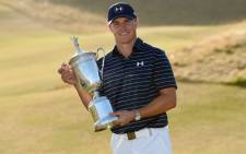 Jordan Spieth of the United States poses with the trophy after winning the 115th US Open Championship at Chambers Bay on 21 June, 2015 in University Place, Washington. Picture: AFP.