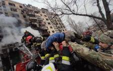 A Russian air strike on a residential building in Kyiv killed one and wounded several others, Ukrainian emergency services said on 14 March 2022.