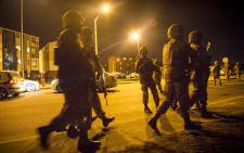 FILE: Members of the SANDF gather outside blocks of flats in a known gang area in Ottery, Cape Town, during a Fiela Operation conducted during the early hours of the morning. Picture: Thomas Holder/EWN