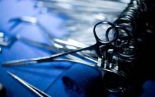 Clamps, scissors and other surgical instruments are seen in an operating room. Picture: AFP