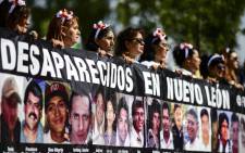Activists, relatives and mothers of missing people, march to demand the Mexican government answers about their loved ones whereabouts, as part of the commemoration of Mothers' Day in Mexico City on 10 May, 2018. Picture: AFP.