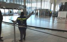 An official pictured on scene at the Cape Town International Airport where one person was wounded during a shooting, on 18 October 2017. Picture: Lauren Isaacs/EWN