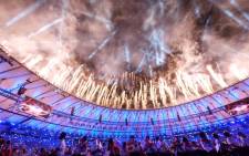 Athletes watch a fireworks display during the closing ceremony of the Rio 2016 Paralympic Games at the Maracana stadium. Picture: AFP.