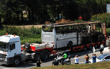 A truck carries the bus damaged by the suicide bomb blast which targeted a group of Israeli tourists at the airport in Bourgas, Bulgaria, on 19 July 2012. Picture: AFP