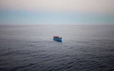 FILE: An overloaded boat of refugees and migrants trying to reach Europe as seen from the deck of the Italian Coastguard ship, the San Giorgio, during a Mediterranean patrol in 2014. Picture: UNHCR/Alfredo D’Amato