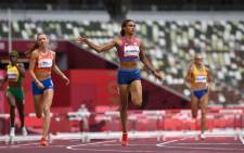 USA's Sydney Mclaughlin (C) wins the women's 400m hurdles final setting a new world record during the Tokyo 2020 Olympic Games at the Olympic Stadium in Tokyo on 4 August 2021. Picture: Jewel Samad/AFP