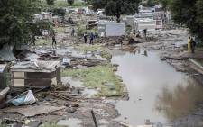 Residents of an informal settlement in Tshwane return to their homes after the flooding. Picture: Abigail Javier/EWN