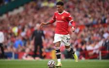 FILE: Manchester United striker Jadon Sancho runs with the ball during the English Premier League football match between Manchester United and Newcastle at Old Trafford in Manchester, north west England, on 11 September 2021. Picture: Oli Scarff/AFP