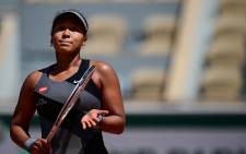 Japan's Naomi Osaka celebrates after winning against Romania's Patricia Maria Tig during their women's singles first round tennis match on Day 1 of The Roland Garros 2021 French Open tennis tournament in Paris on May 30, 2021. Picture: Martin Bureau / AFP.