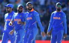 India's captain Virat Kohli (C) and teammates at end of play during the 2019 Cricket World Cup group stage match between West Indies and India at Old Trafford in Manchester, northwest England, on 27 June 2019. India beat West Indies by 125 runs. Picture: AFP