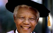 Former South African president and Nobel Peace Prize laureate Nelson Mandela wears a traditional mortar board while receiving two honourary doctorates at the Sydney University, 04 September 2000. Picture: AFP