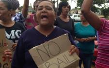 FILE: Community members chant 'no bail' outside court where Justin Langley's alleged killers appeared on 11 November 2014. Picture: Lauren Isaacs/EWN.