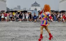 An LGBT rights activist poses for photos during a gay pride parade outside the Chiang Kai-shek Memorial Hall in Taipei on 28 June 2020. Picture: AFP