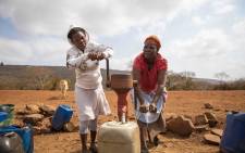Two women pump water from a borehole in Emanyiseni, Kwa-Zulu Natal. Picture: Thomas Holder/EWN