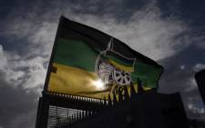 FILE: An ANC flag flies outside a polling station in Langa, near Cape Town. Picture: AFP