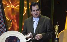 In this file photo taken on May 22, 2004, Indian veteran actor Dilip Kumar speaks at the podium for his award for outstanding achievement in Indian cinema at the 5th International Indian Film Academy (IIFA) Awards in Singapore. Picture: Roslan Rahman / AFP
