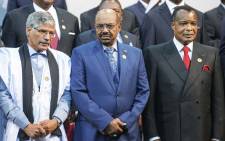 Sudanese President Omar al-Bashir (C), Congo’s president Denis Sasso-Nguesso (R) and Prime Minister of the Sahrawi Arab Democratic Republic Abdelkader Taleb Oumar (L) pose during a photo call at the 25th AU Summit in Sandton on 14 June 2015. Picture: AFP